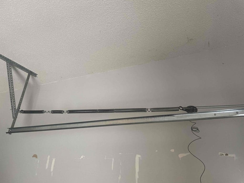 Broken garage door extension spring before glaze