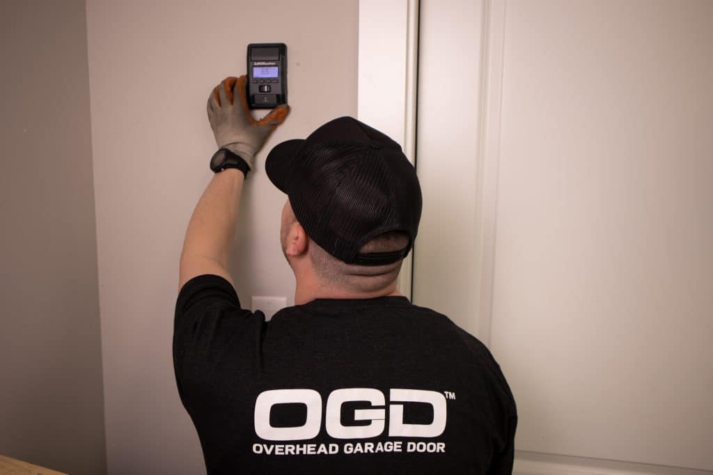 Garage door safety wall opener
