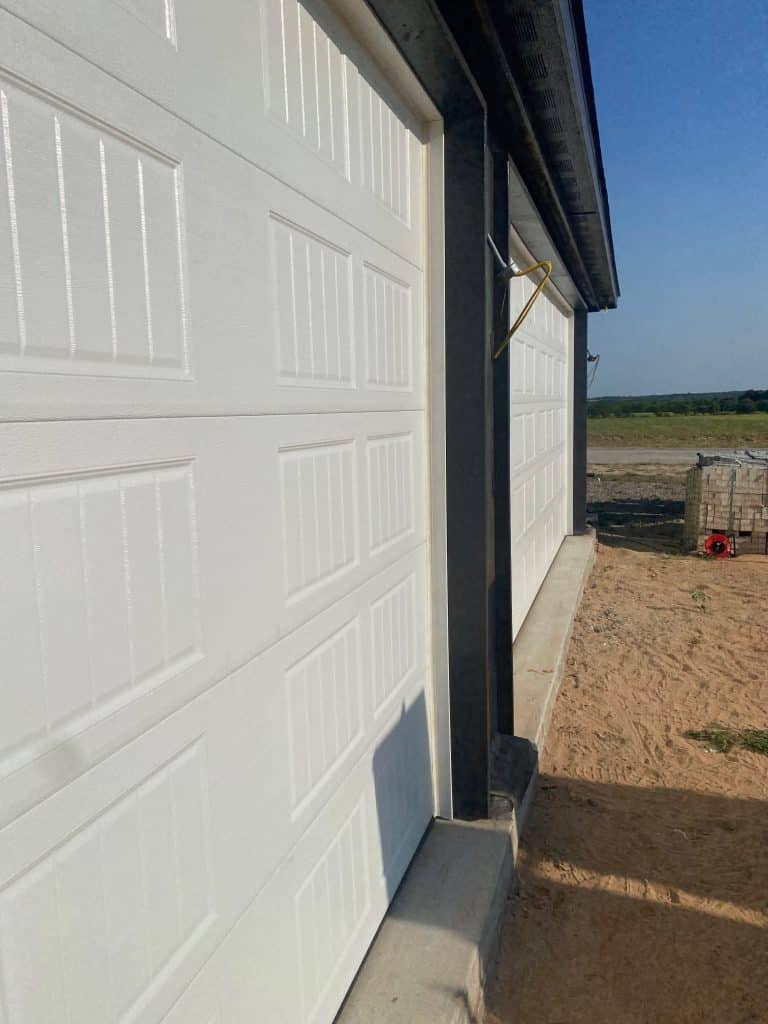 Long raised panels for steel garage doors