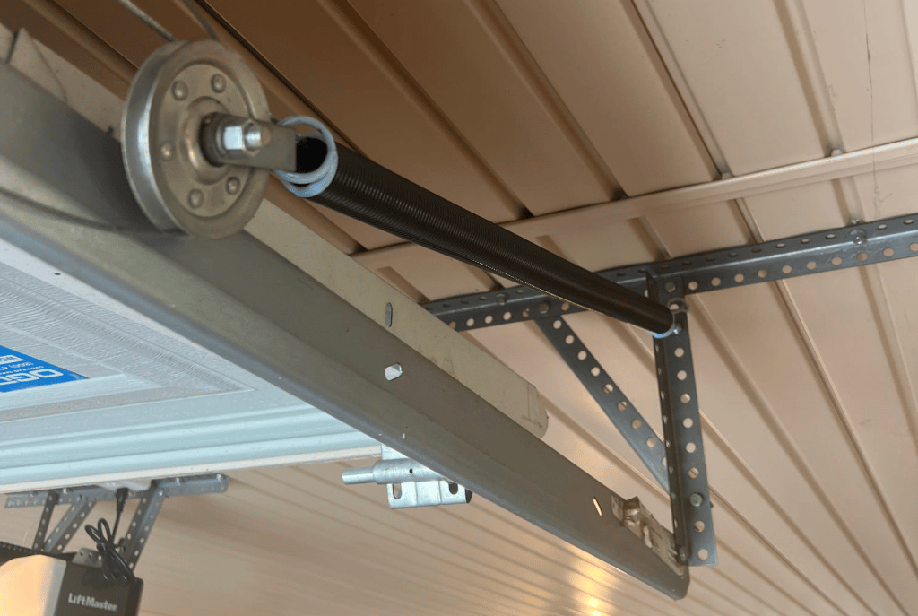 Clean garage door pulley system